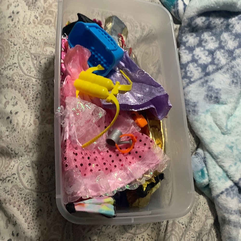 Large mix of doll clothes and accessories